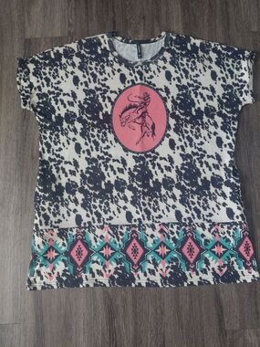 Black & White Cowprint Top with Pink Rodeo Graphic